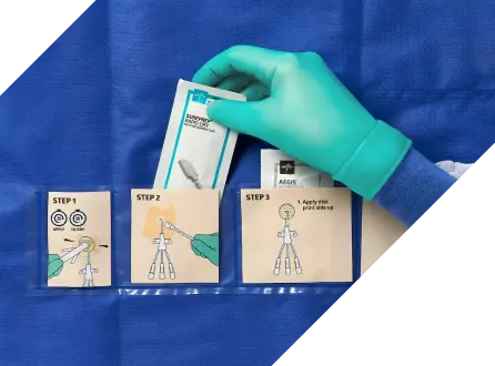 A gloved hand selects skin cleanser from a CVC dressing change kit
