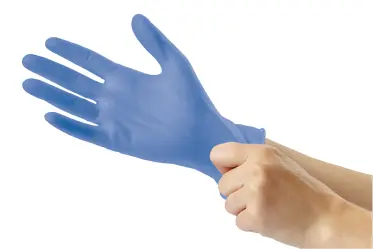 Hands putting on medical glove