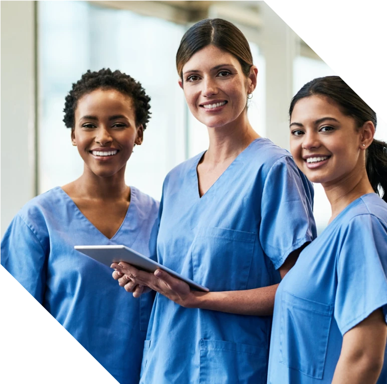 three female senior care aides in a smiling portrait