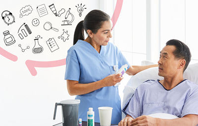 Nurse talking to patient in bed